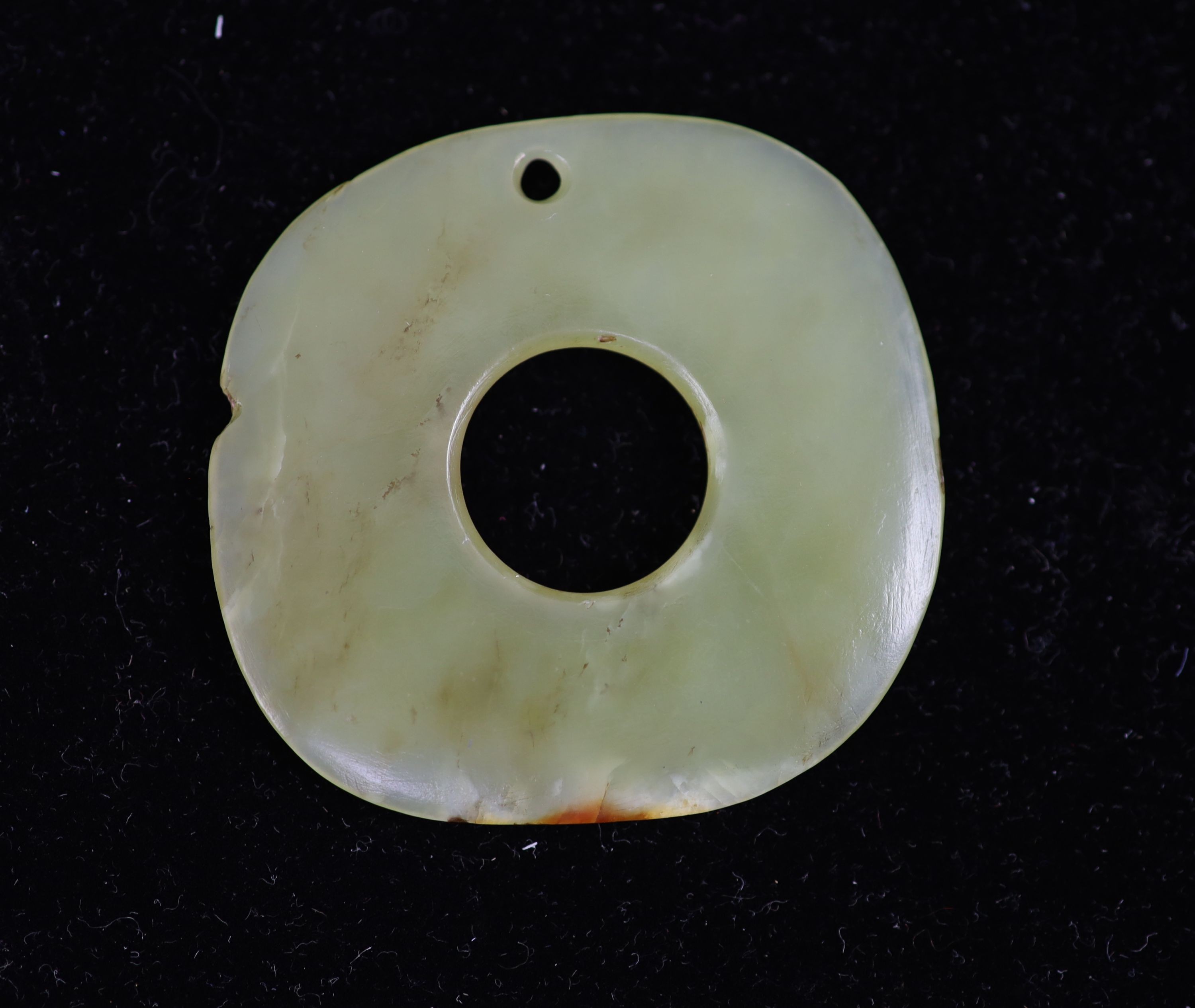 A Chinese yellow jade bi disc, possibly Hongshan Culture, 4.6 cm, nick to edge